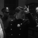 A cop member of the Cyclops organization letting his fellow racists know he’s going to let a criminal go free.